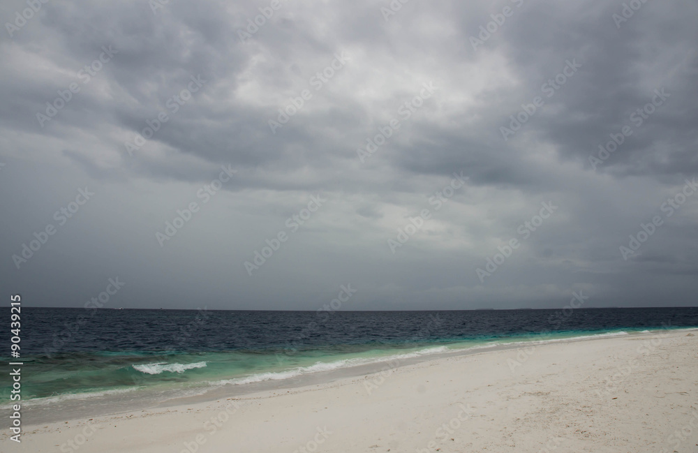 The beach and ocean on a cloudy day

