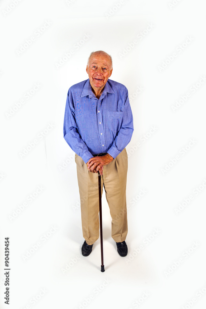 Fototapeta premium happy elderly man standing with his walking stick