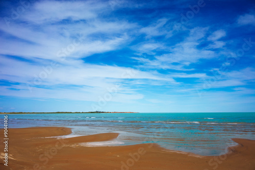 The blue sea, blue sky, yellow sand. Beach.