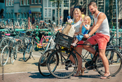 Parents on bikes at the streets of Amsterdam