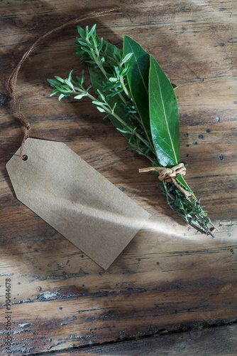 bouquet garni of thyme and bay leaf, a blank label next