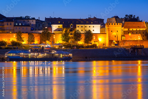 Old town of Torun at night reflected in Vistula river, Poland © Patryk Kosmider