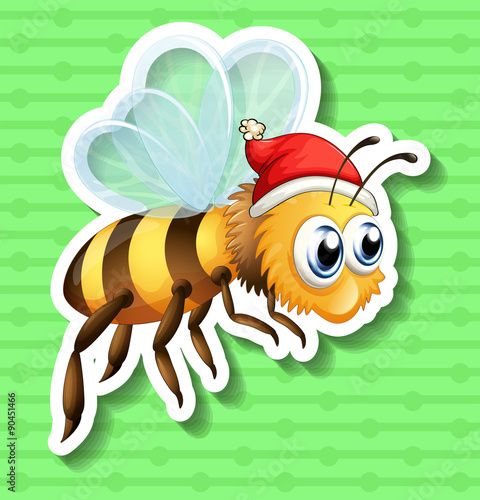 Sticker of bee wearing christmas hat