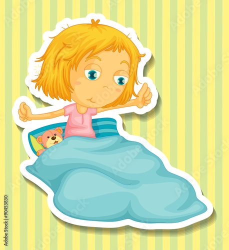Little girl in bed waking up