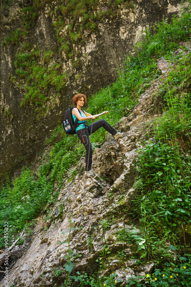Obraz premium Hikers climbing on a safety chain