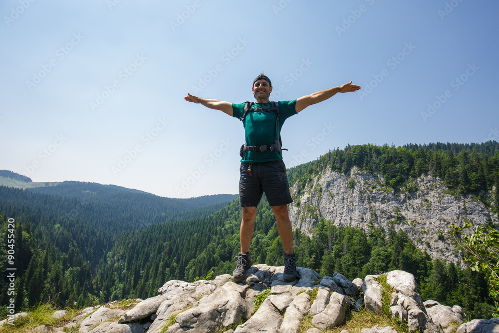 Hiker on the mountain peak Hiker on the mountain peak