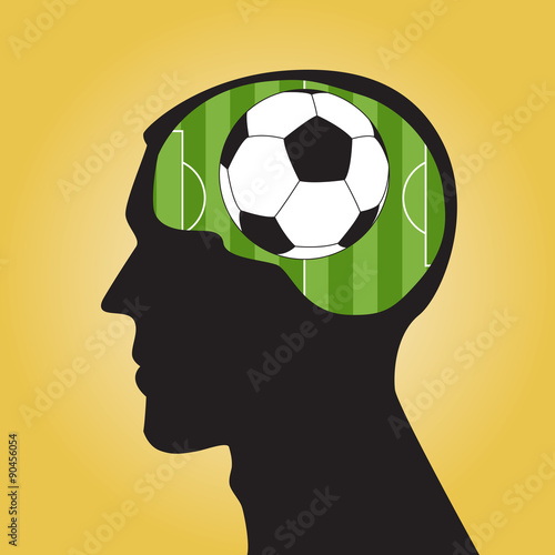 Man head silhouette with a soccer ball inside.