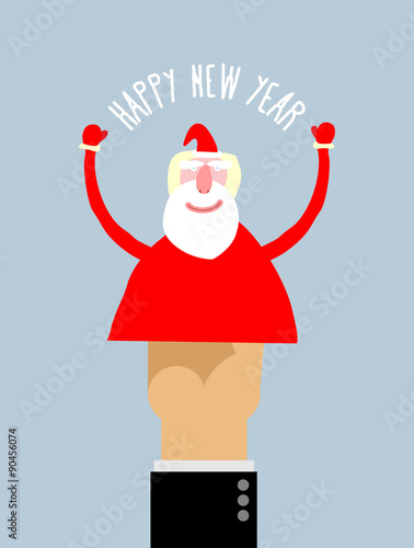 Happy new year. Businessman hand manipulation Doll arm Santa Cla