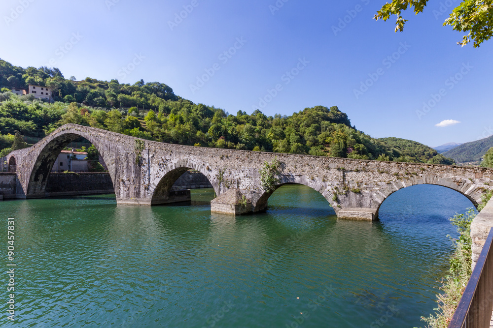 The medieval Devil's bridge across the Serchio river in the village of Borgo a Mozzano in the province of Lucca, Tuscany, Italy
