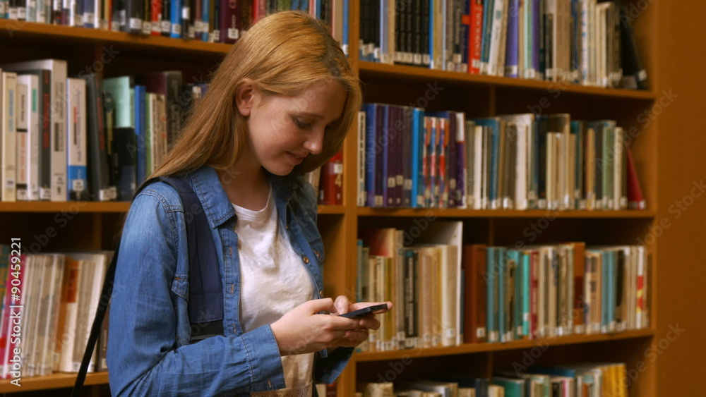Student using her smart phone Student using her smart phone