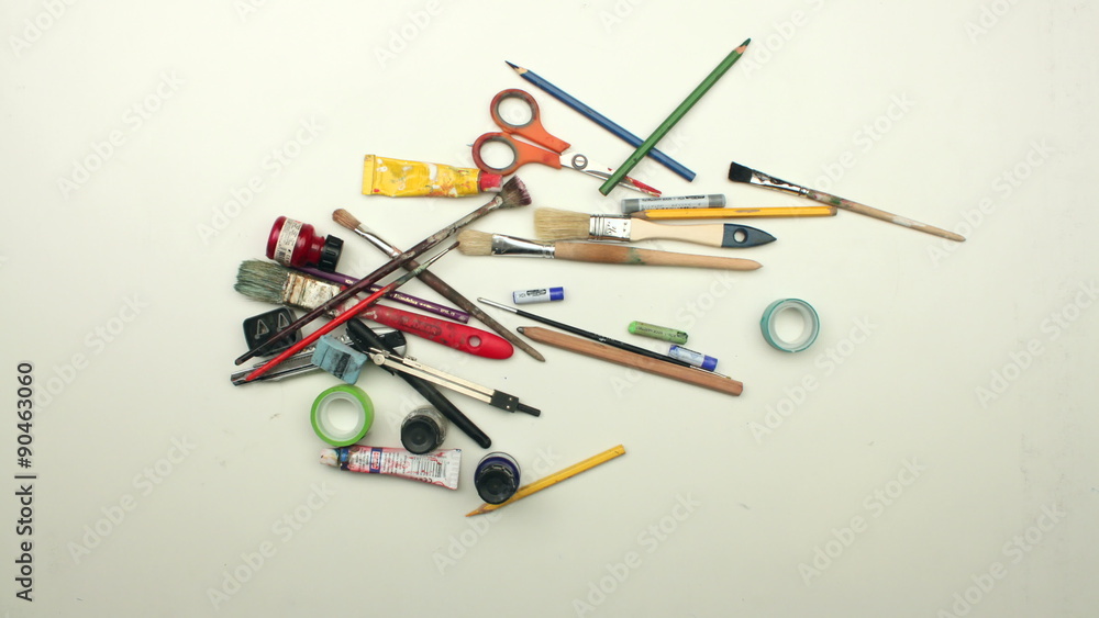 Moving art supplies on white table - stop motion animation Moving art supplies on white table - stop motion animation