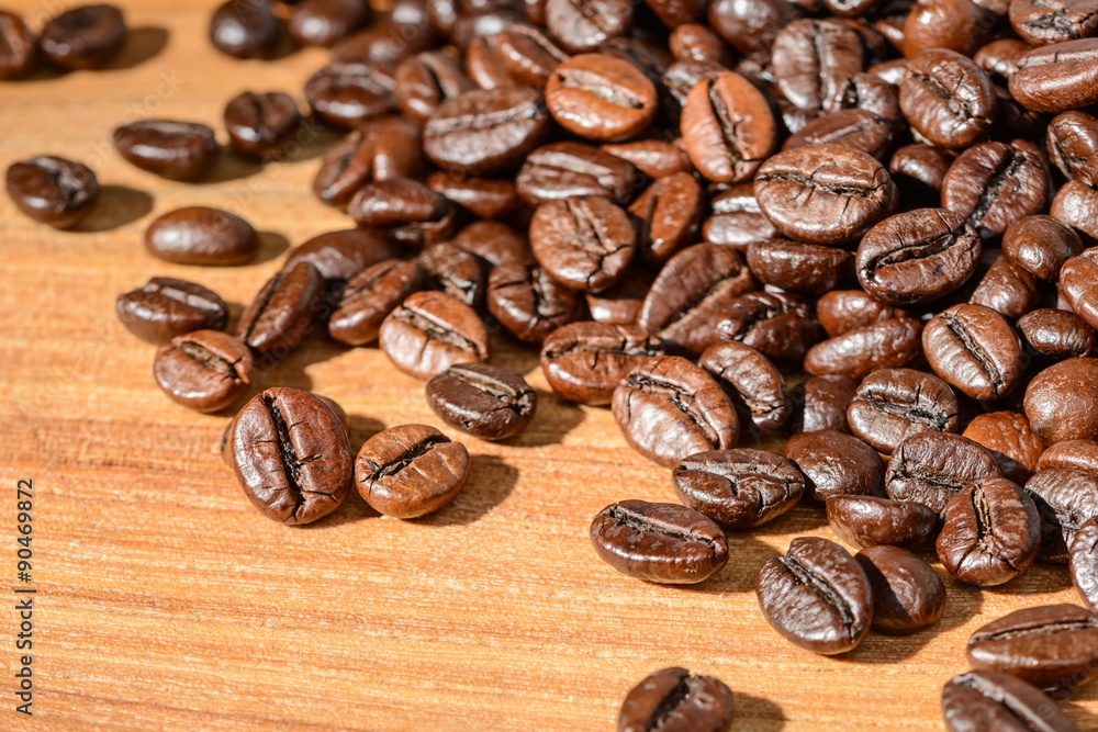 coffee beans on the wooden board coffee beans on the wooden board