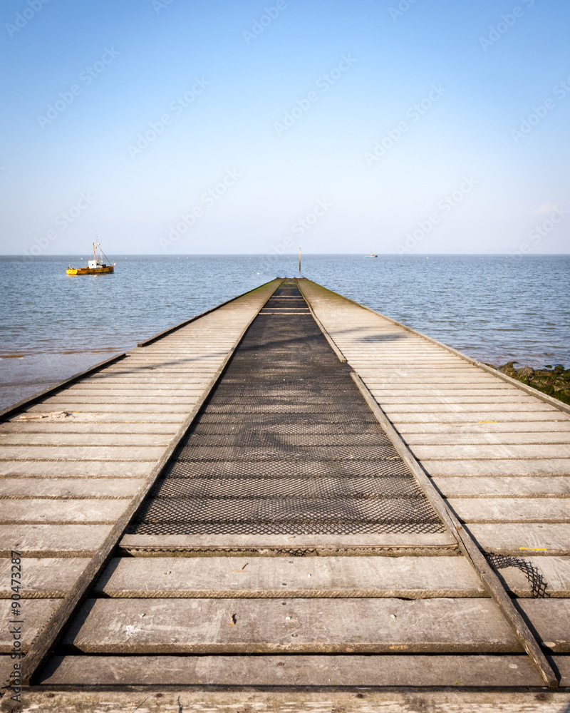 Boat slipway. A symmetrical perspective view of a boat slipway in the seaside town of Morecambe, Lancashire, UK.