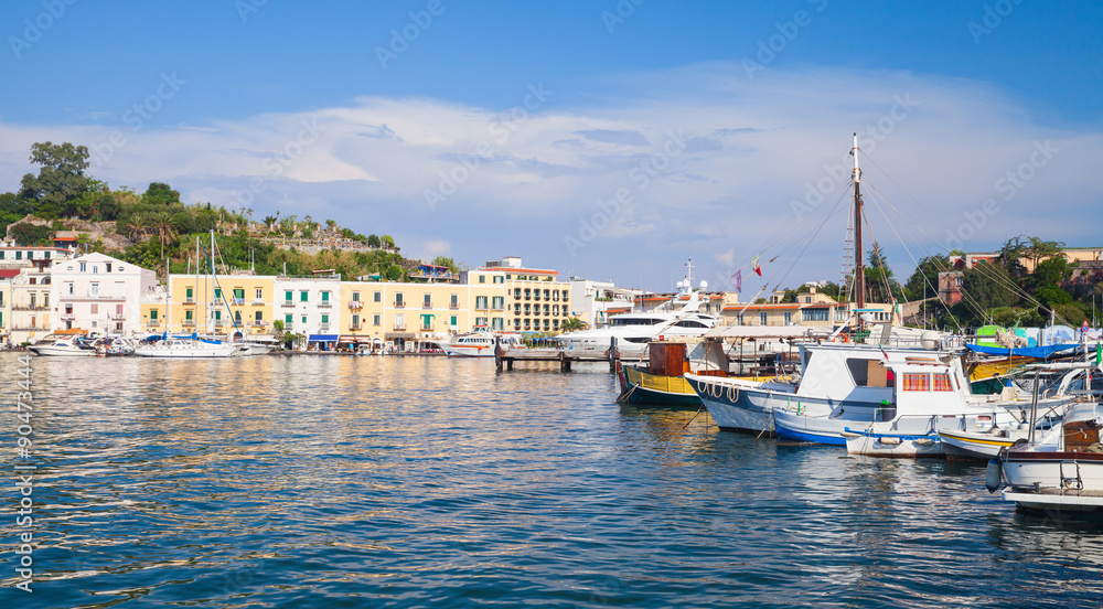 Ischia port cityscape, harbor with fishing boats