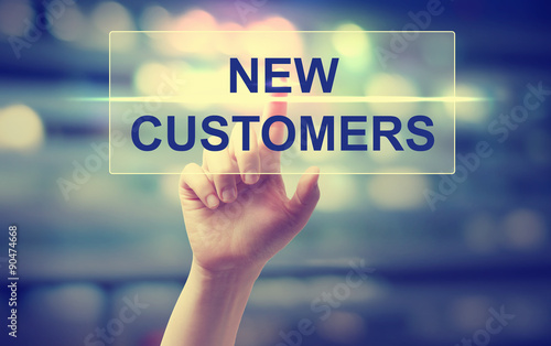Εκτύπωση καμβά Hand pressing a new customers button on blury city lights background