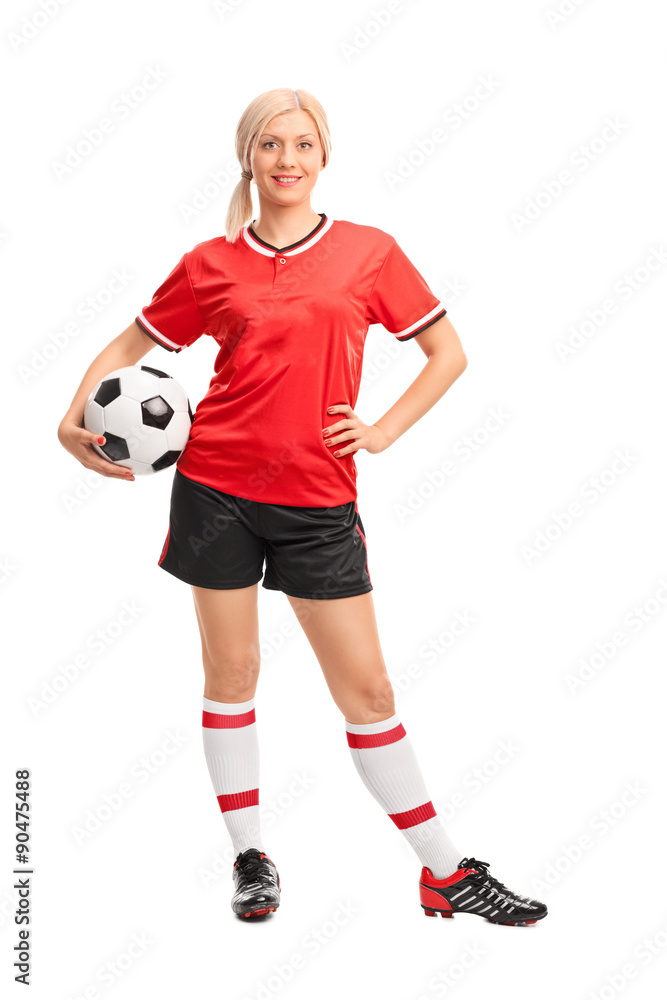 Female football player holding a ball
