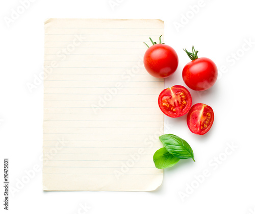 chopped tomatoes and basil leaf with blank paper