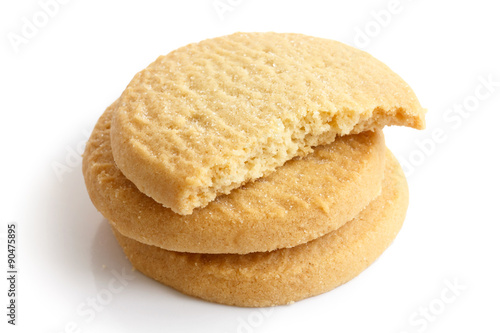 Three round shortbread biscuits isolated on white. Half biscuit.