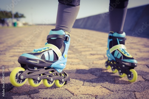 Close up view of woman wearing inline skates photo