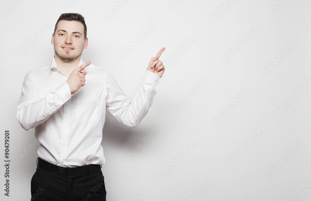 business man points with fingers in the right side business man points with fingers in the right side