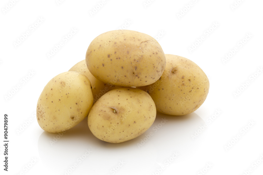 Potatoes on the white background. New harvest. Potatoes on the white background. New harvest.