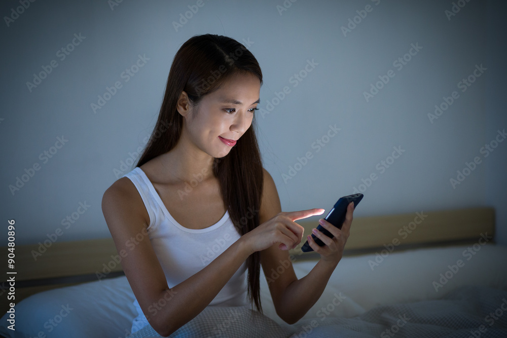 Woman use of the cellphone at home