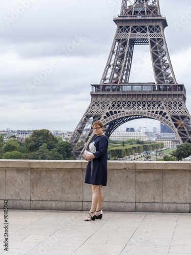 PARIS, FRANCE, on SEPTEMBER 1, 2015. The tourist is photographed near the Eiffel Tower