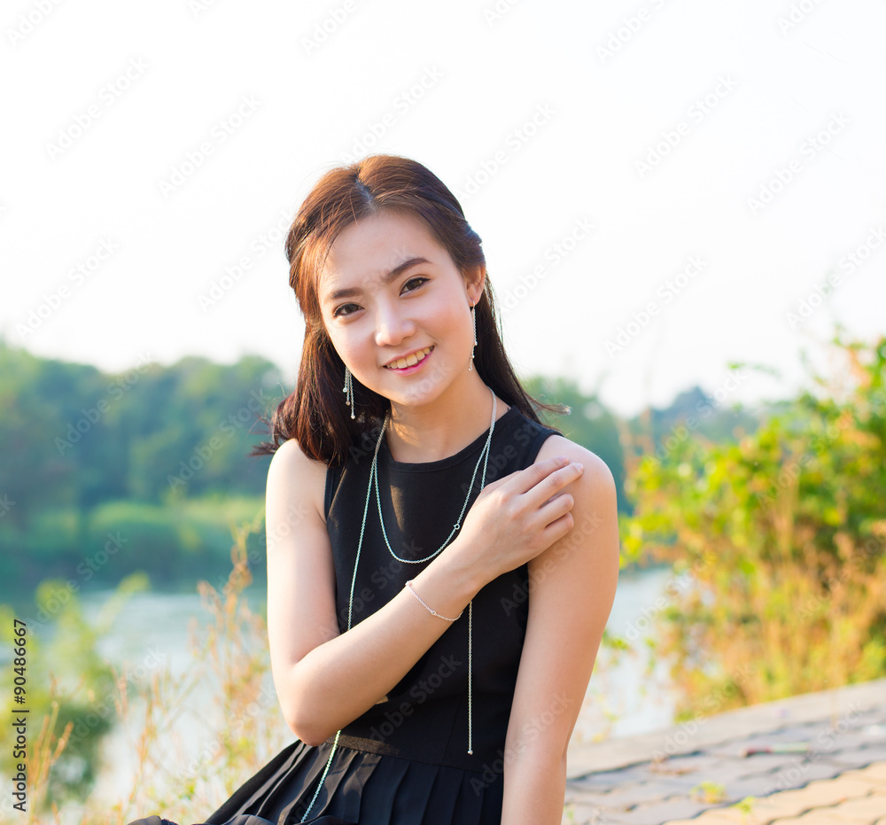 beautiful and smiling asian young woman beautiful and smiling asian young woman