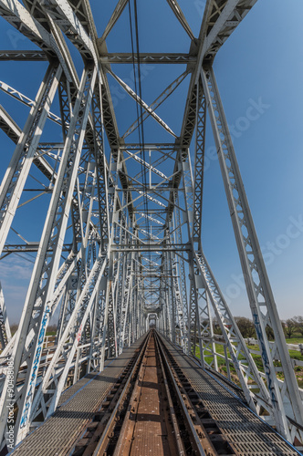 Railway steel truss bridge in Brzegi, Poland, near Krakow, over Vistula river #90488085
