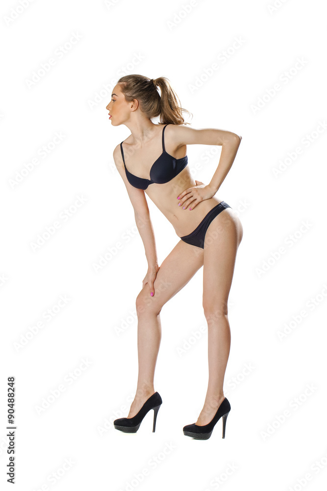 Full length portrait of a beautiful young model in black bikini Full length portrait of a beautiful young model in black bikini