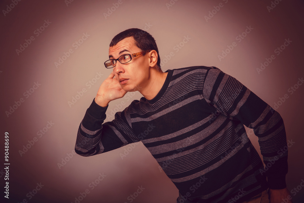 European-looking male of about thirty brunet put his hand to his European-looking male of about thirty brunet put his hand to his