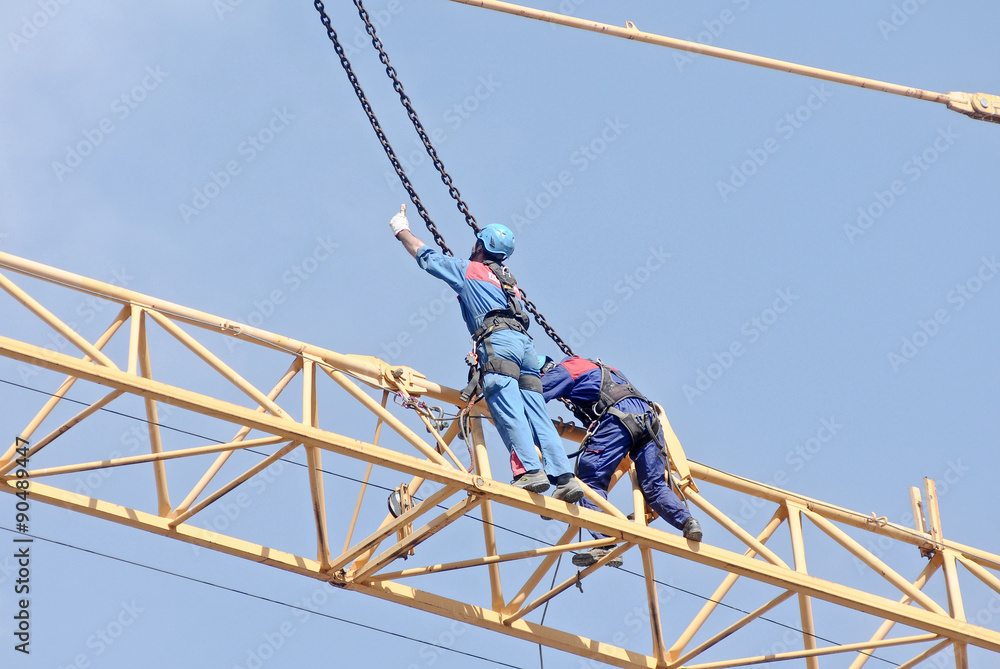 Men at work on the crane Stock-Foto | Adobe Stock