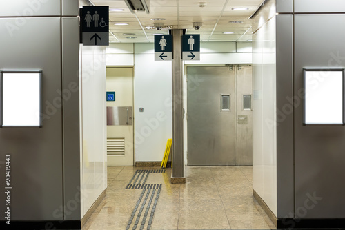 Public restroom signs with a disabled access symbol