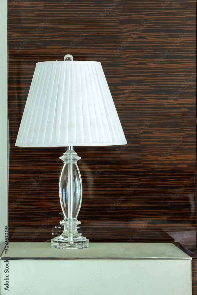 White table lamp in bright on wooden table