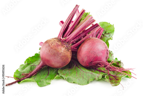 Red beetroots on green leaf isolated