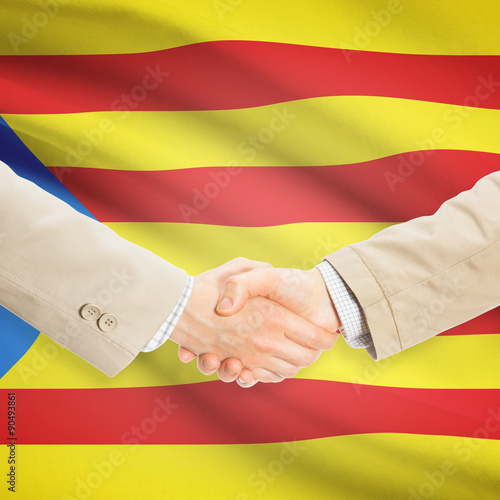 Businessmen handshake with flag on background - Estelada - Spain
