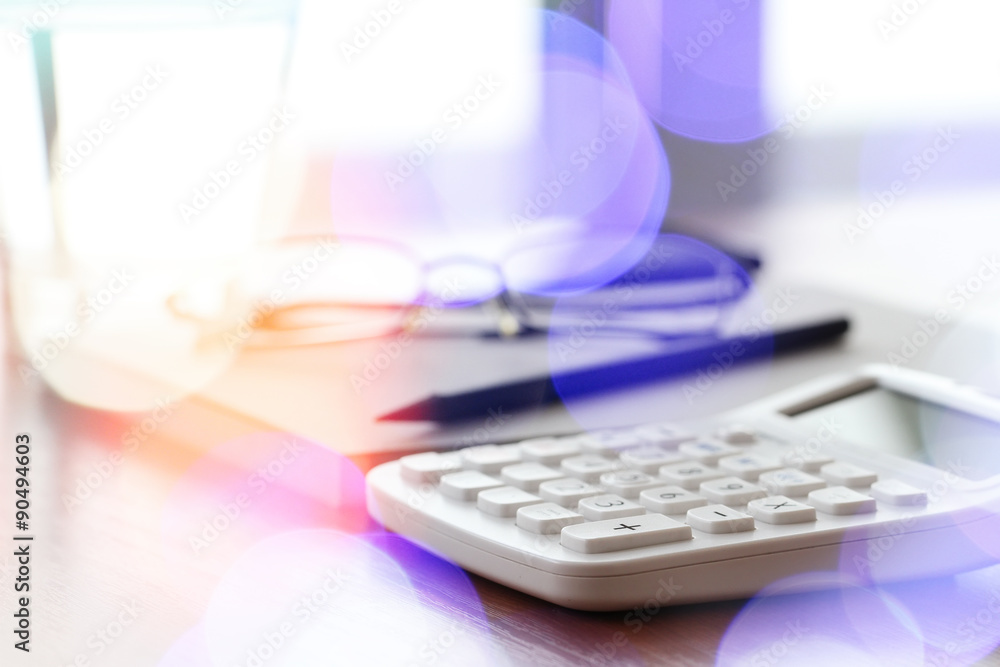 close up of business documents on office table with calculator a close up of business documents on office table with calculator a