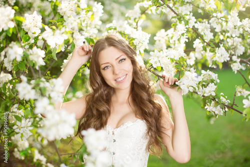 Young spring fashion woman in spring garden Springtime Summertim photo