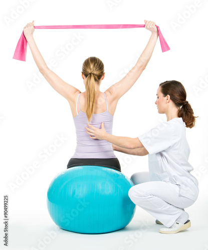 doctor with medical ball and woman patient
