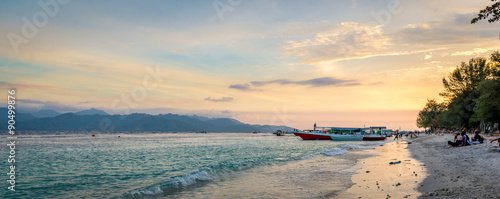 Beautiful beach with traditional boat during sunset Gili Air & Gili Trawagan