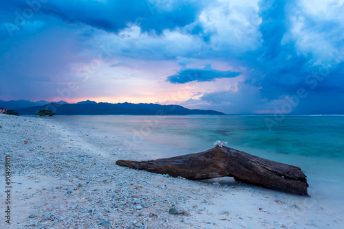 Big log on the beach on a stormy day, Gili Air - Indonesia
