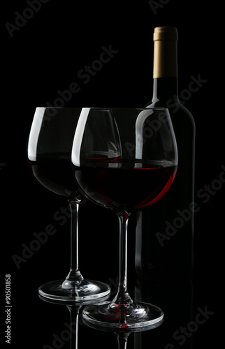 Wineglasses with red wine, isolated on black