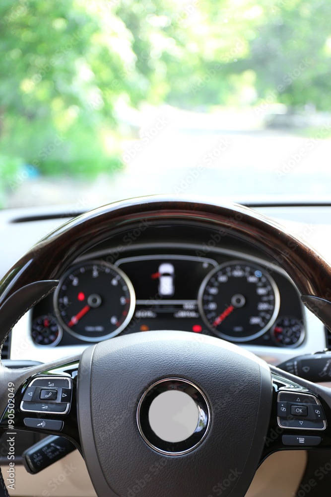 Modern car illuminated dashboard and steering wheel