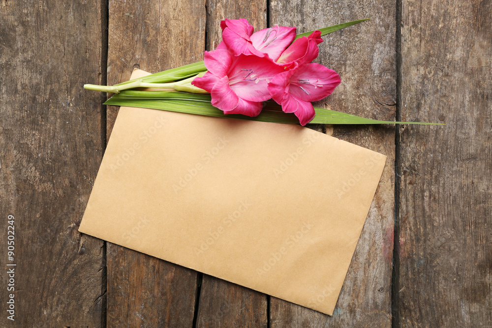 Blank card with beautiful gladiolus on wooden background Blank card with beautiful gladiolus on wooden background