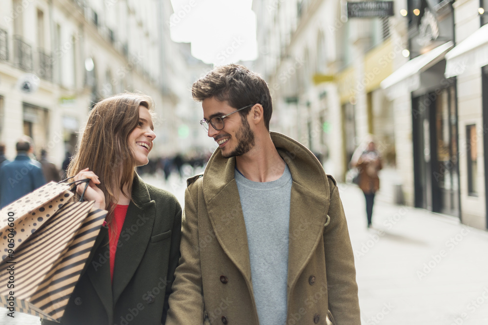 stylish young couple doing shopping in the street stylish young couple doing shopping in the street
