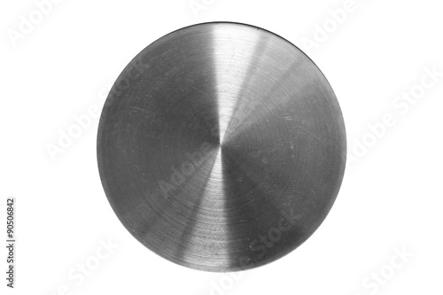polished round piece of metal with scratches