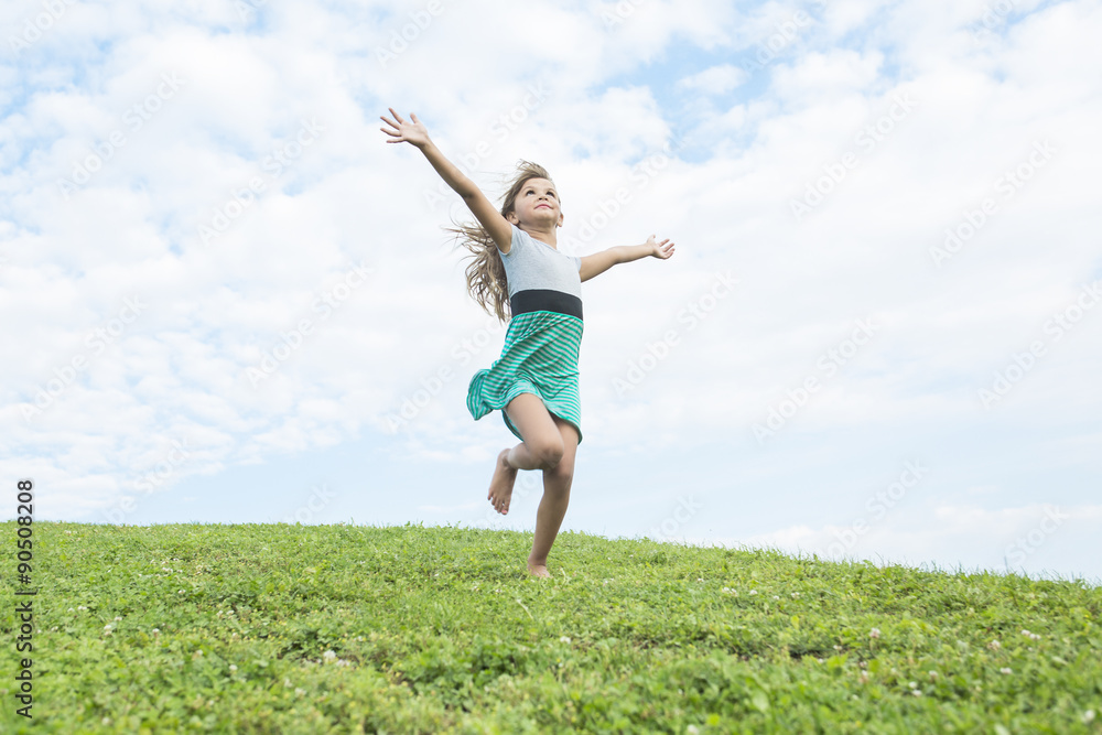 Beautiful portrait of a little girl outside on grass Beautiful portrait of a little girl outside on grass