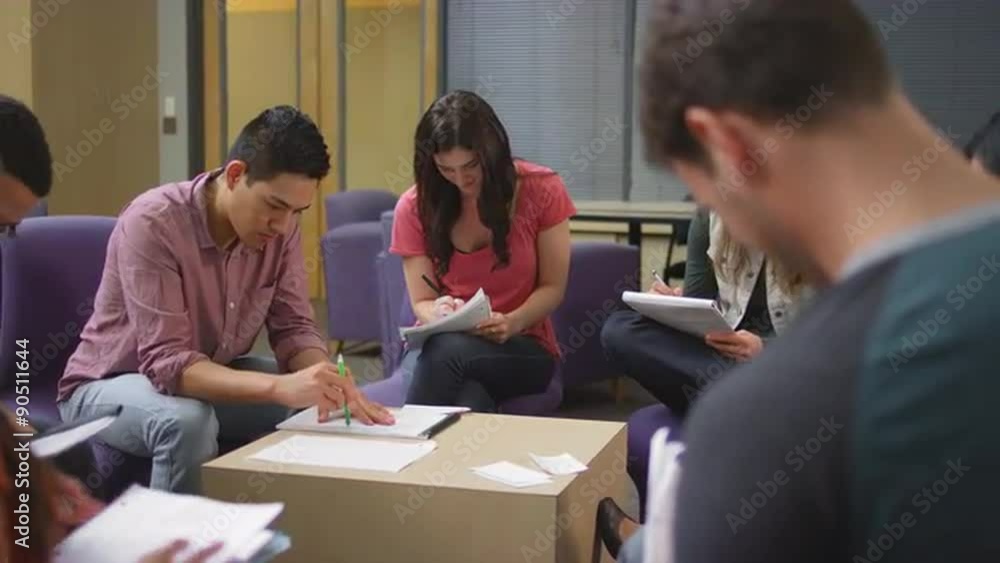 A group of students working on their homework together
A group of students working on their homework together