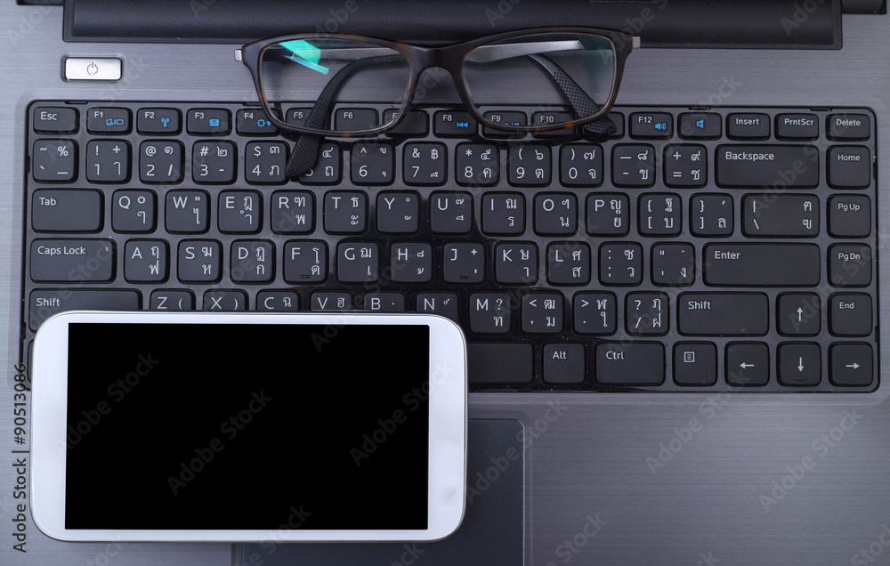 Office workplace with laptop and smart phone Office workplace with laptop and smart phone