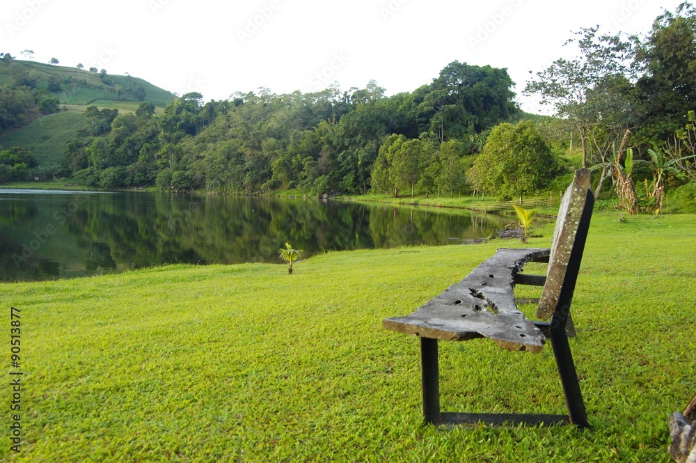 Wooden bench by the lake in Lake Apo, Bukidnon Philippines photo image